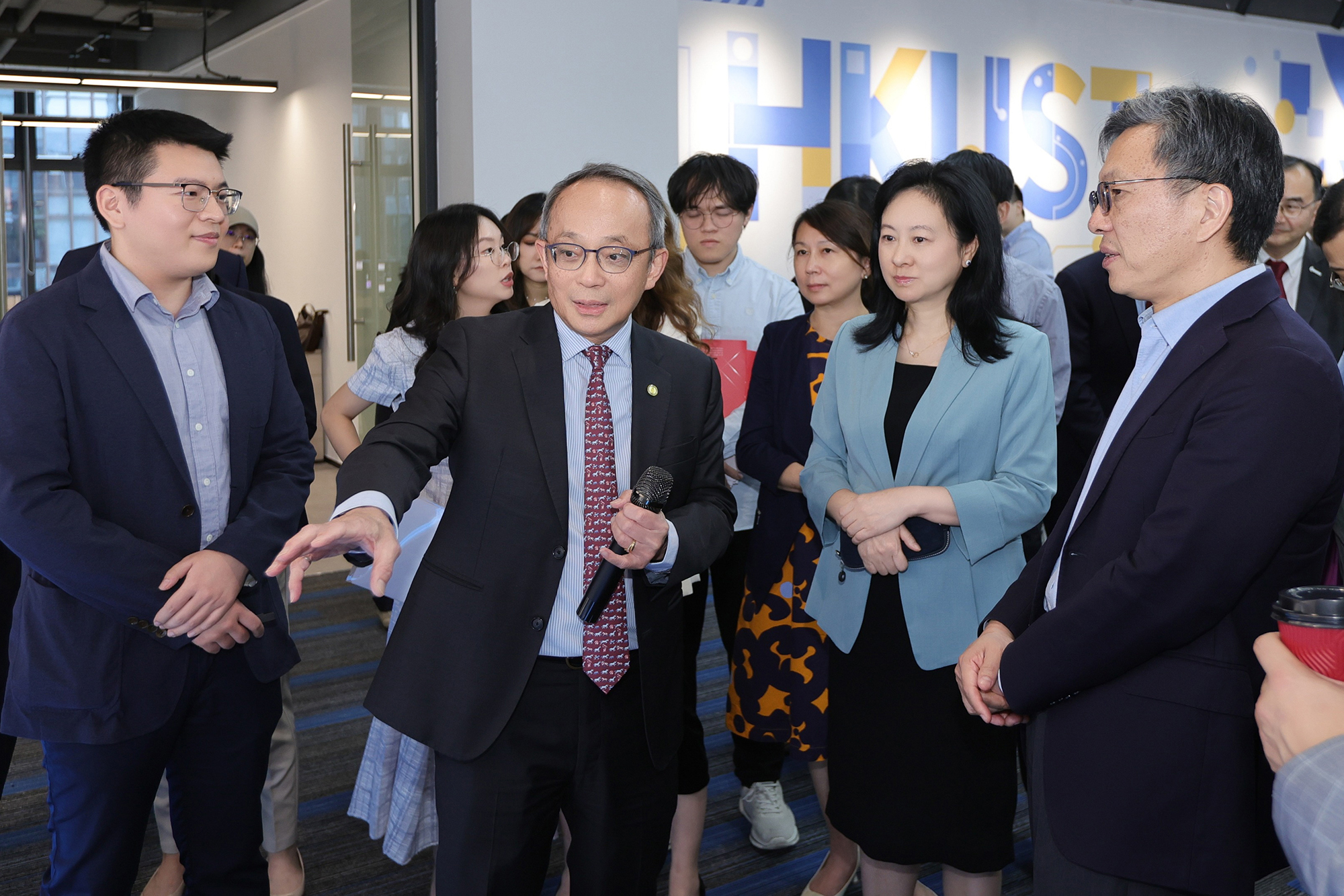 Prof. Tim Kwang-Ting CHENG (second left), Center Director of ACCESS and Vice-President for Research and Development at HKUST, engaged in an in-depth discussion on ACCESS latest technological achievements to Ms. Ping WEN (second right), Deputy Director General of the Qianhai Authority and Prof. Harry Heung-Yeung SHUM (first right), HKUST Council Chairman.
